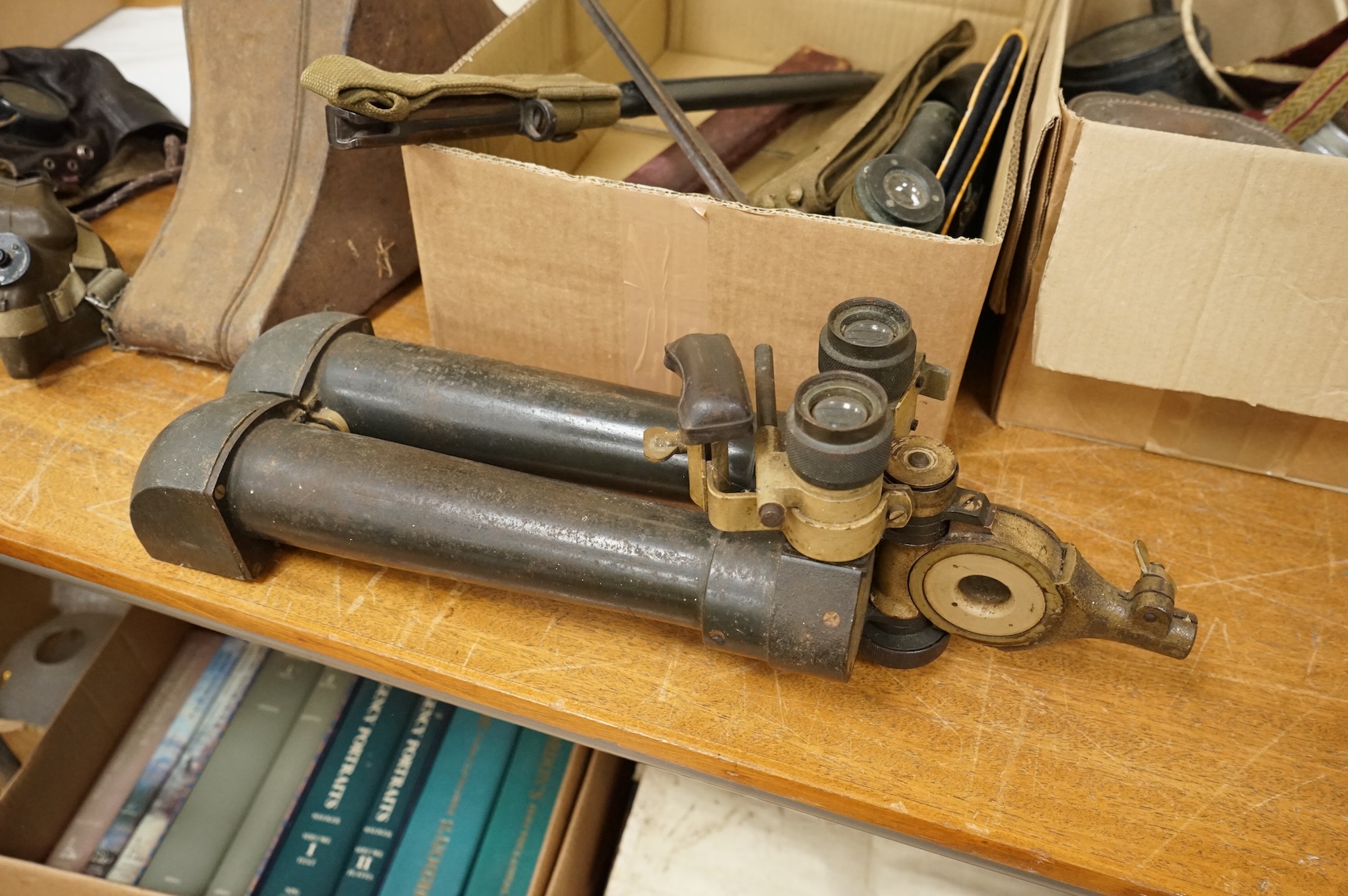 A collection of militaria including; a US Air Force camera Type N-6, a leather cased Bell & Howell Sportster camera and accessories, a pair of periscope binoculars, a leather cased compass by Goerz, Berlin